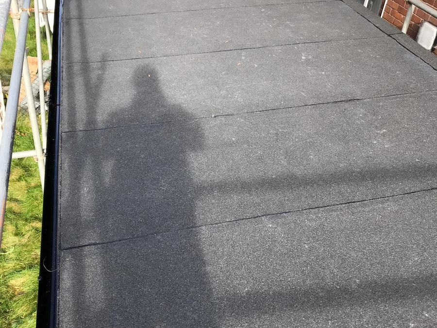 A felt flat roof over a garage
