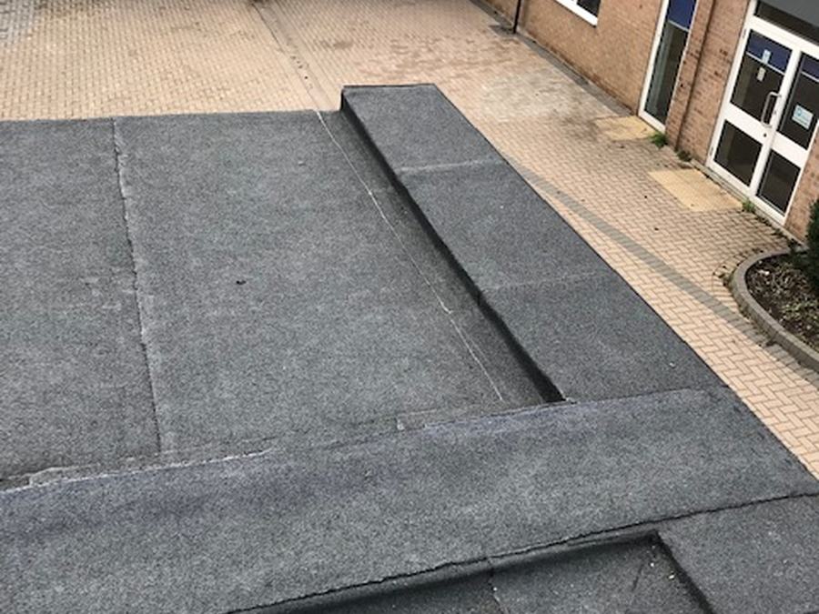 A completed felt flat roof on a bungalow